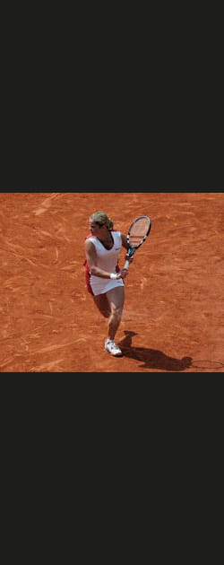 Kim Clijsters entour&eacute;e de champions