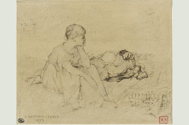 Femme assise dans l'herbe